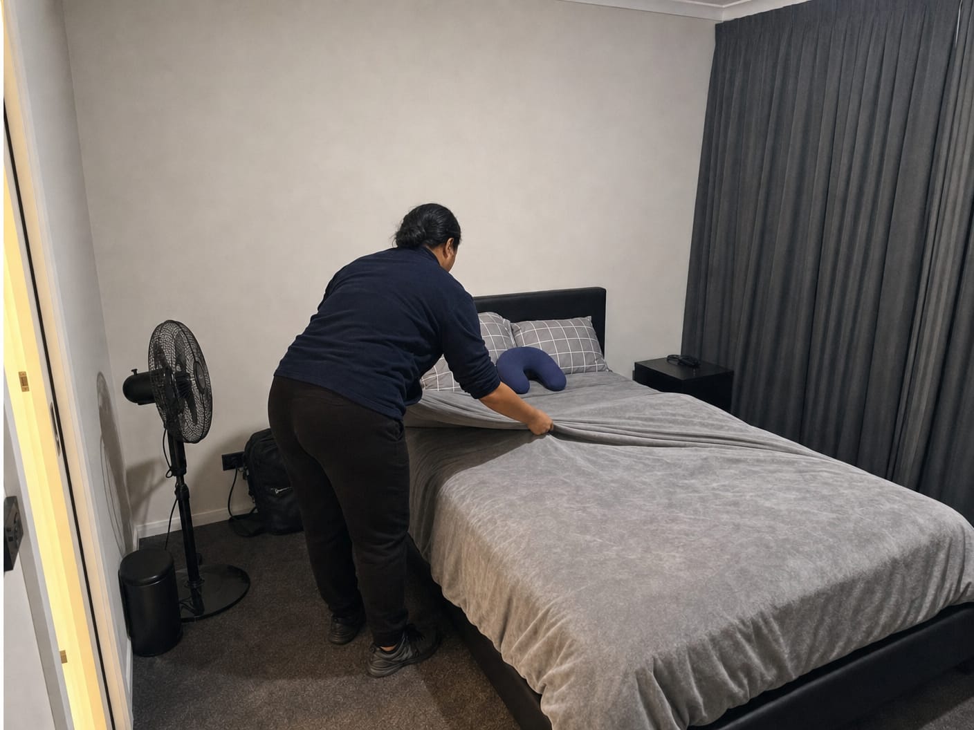 Vine Cleaning preparing an Airbnb bed for guests